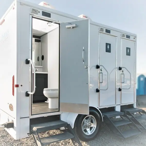 view from outside of interior of luxury portable restroom for weddings