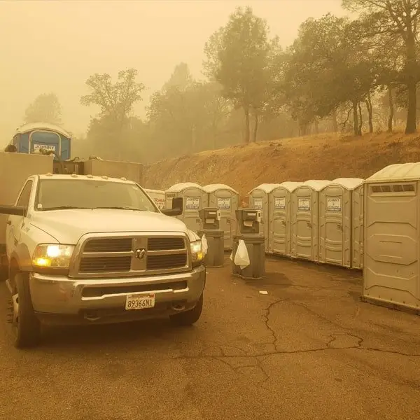 truck in front of a row of construction units during fire